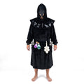 Man standing in the ankle-length Long black Plague Doctor hooded blanket robe with beak mask, potions, garlic and rats