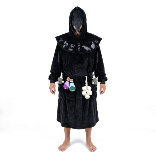 Man standing in the ankle-length Long black Plague Doctor hooded blanket robe with beak mask, potions, garlic and rats